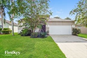 Lake Mary house for rent - a house with a driveway and a garage door