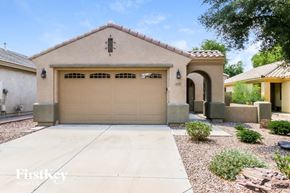 Gilbert house for rent - A house with a garage and a driveway in front of it.