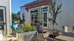 Morgan Hill apartment for rent - A patio with a table, chairs, and a potted plant.