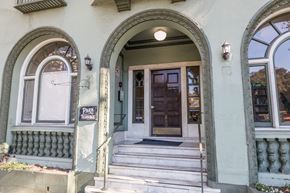 Oakland apartment for rent - A building with a wooden door and a sign that says "PARK".