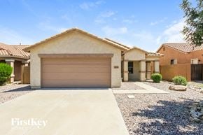 Queen Creek house for rent - a house with a garage door in front of it