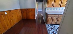 Cincinnati apartment for rent - a kitchen with wooden floors and wooden cabinets
