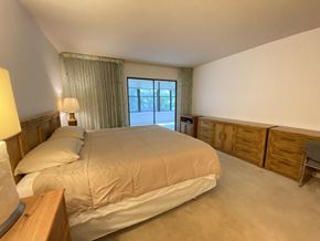 Bradenton house for rent - a bedroom with a bed and dressers and a window