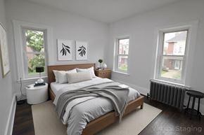 Chester apartment for rent - A bedroom with a bed, nightstand, and two windows.