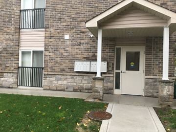 Oshawa apartment for rent - A brick building with the number 137 on it.