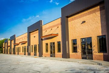 Colorado Springs apartment for rent - A building with a red brick facade and large windows.