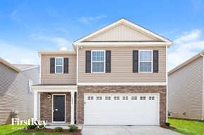 Dallas house for rent - A two-story house with a garage is showcased in the image.