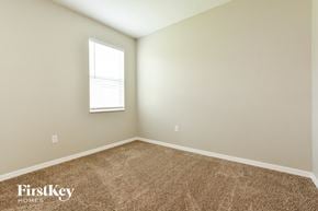 Kissimmee house for rent - the upstairs bedroom with carpet and a window