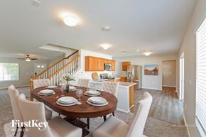 Denver house for rent - A dining room with a wooden table set for six.
