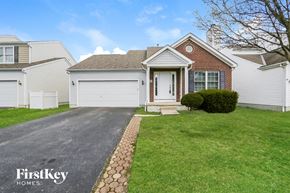 Galloway house for rent - a white house with a white garage door and a lawn