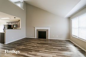 Galloway house for rent - a living room with wood floors and a fireplace