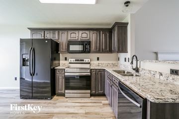 Galloway house for rent - a kitchen with stainless steel appliances and marble counter tops