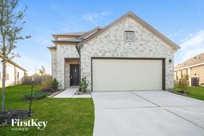 Katy house for rent - A house with a garage door is for sale by FirstKey Homes.