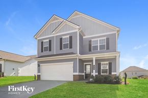 Adairsville house for rent - a gray house with a lawn in front of it