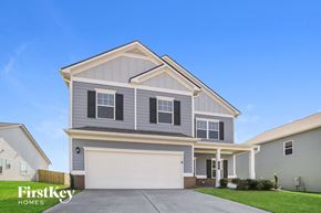 Adairsville house for rent - a gray house with a white garage door
