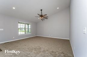 Troy house for rent - a room with carpet and a ceiling fan