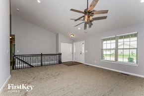 Troy house for rent - an empty living room with a ceiling fan and a staircase