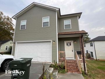 Concord house for rent - a gray house with a white garage door