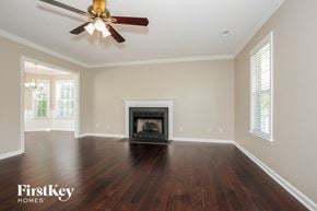 Lexington house for rent - the living room with wood flooring and a fireplace