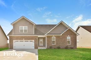 Clarksville house for rent - a brick house with a lawn in front of it