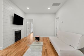 Guilford apartment for rent - a living room with a white couch and a fireplace