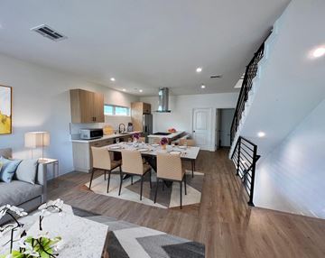 North Hollywood apartment for rent - a living room with a dining room table and a kitchen