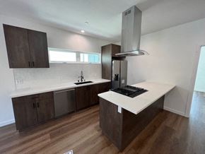 North Hollywood apartment for rent - a kitchen with a white counter top and a refrigerator