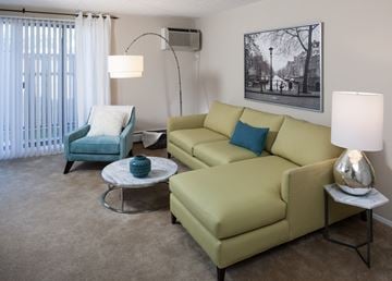 Westland apartment for rent - a living room with a couch and chair and a coffee table