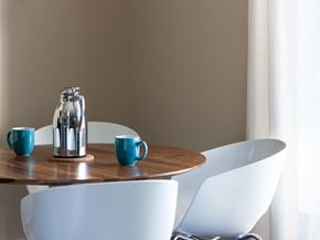 Westland apartment for rent - a table with chairs and a pitcher and cups on it