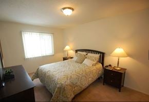 Westland Mi apartment for rent - a bedroom with a bed and two night stands
