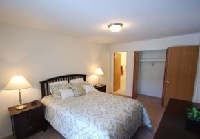 Westland Mi apartment for rent - a bedroom with a bed and a door to a bathroom