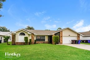 Saint Cloud house for rent - A house with a well-maintained lawn and a clear blue sky above.