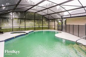 Saint Cloud house for rent - A pool inside a house with FirstKey Homes written on the side.