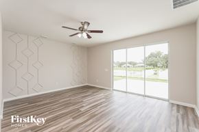 Parrish house for rent - A room with a FirstKey Homes logo on the wall.