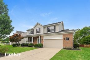 Springboro house for rent - a house with a lawn and a sidewalk in front of it