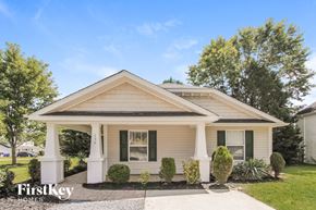 Mooresville house for rent - a small white house with white pillars and a porch