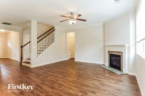 Chelsea house for rent - A spacious living room with wood flooring and a fireplace.