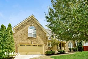 Mount Juliet house for rent - A house with a garage door that says Firstkey Homes.