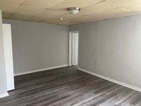 Gloucester City apartment for rent - A room with a wooden floor and a white ceiling.
