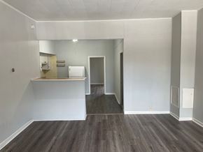 Gloucester City apartment for rent - A room with a white wall and a grey floor.