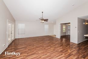 Avondale house for rent - a living room with wood flooring and a ceiling fan