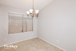 Avondale house for rent - a dining room with a window and a chandelier
