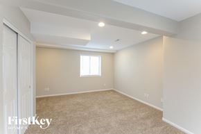 Thornton house for rent - a bedroom with carpet and a closet and a window