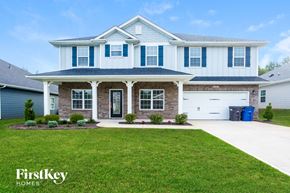 Statesville house for rent - a large house with a lawn in front of it