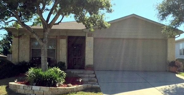 Cibolo house for rent - a tan house with a tree and a driveway