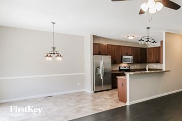 Lake St Louis house for rent - a kitchen with a stainless steel refrigerator and a counter top