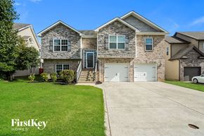 Clarksville house for rent - A house with a garage and a driveway is for sale.