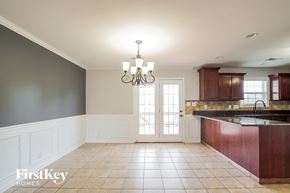 Clarksville house for rent - A kitchen with a chandelier and a sink.