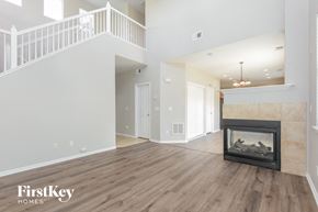 Castle Rock house for rent - the living room of a new home with a fireplace