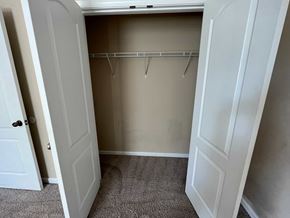 Hope Mills house for rent - a walk in closet in a bedroom with a door open